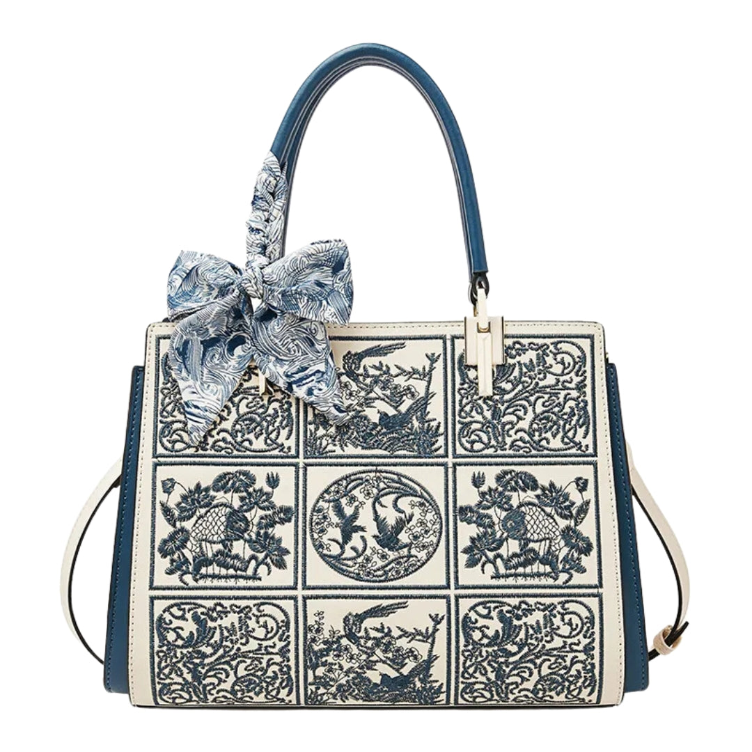 Sylvia™ – Unikalna torebka crossbody z haftem i kokardą