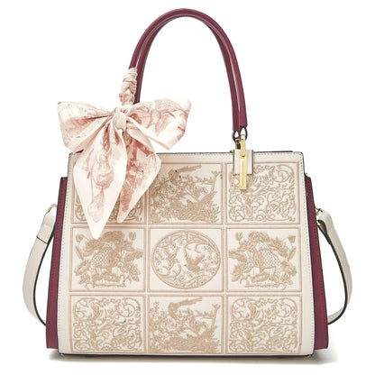 Sylvia™ – Unikalna torebka crossbody z haftem i kokardą