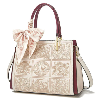 Sylvia™ – Unikalna torebka crossbody z haftem i kokardą