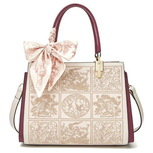 Sylvia™ – Unikalna torebka crossbody z haftem i kokardą